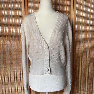 White Cotton On cardigan with polka dot detail and front button closure.